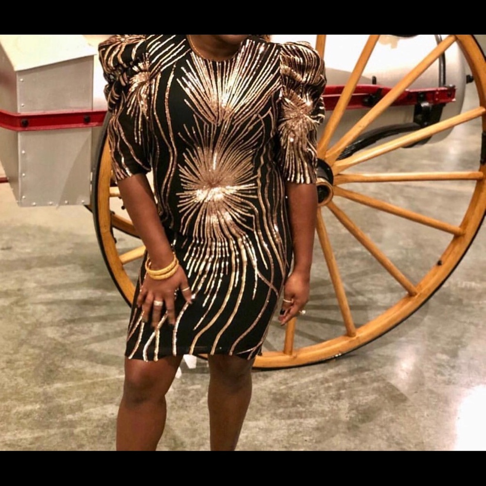 Black and rose gold sequin dress.